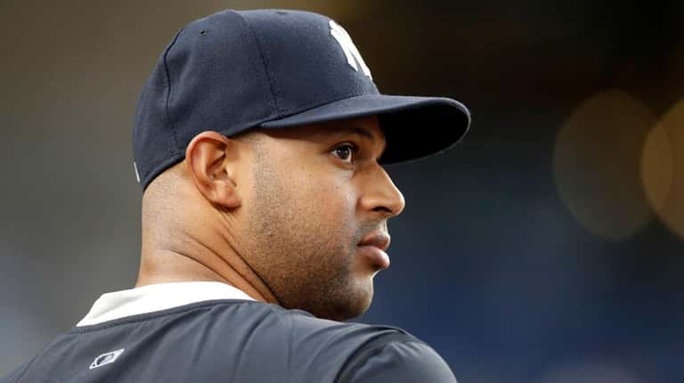 Aaron Hicks of the Yankees looks on against the White Sox...