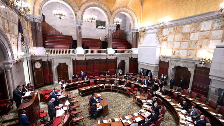 Members of the New York Senate work on legislative bills...