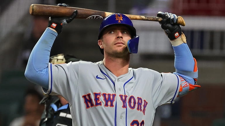 Pete Alonso #20 of the Mets reacts after striking out in...