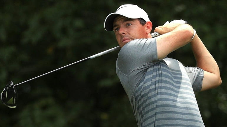Rory McIlroy plays his shot during a practice round prior...