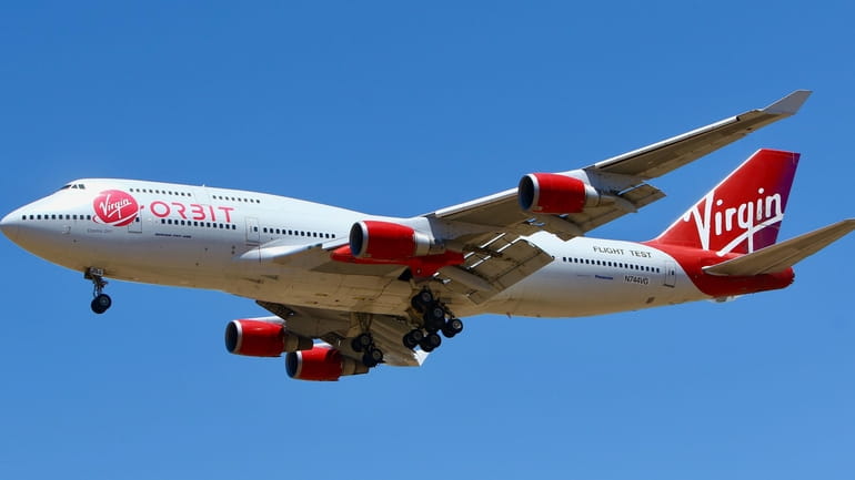 A Virgin Orbit Boeing 747-400 aircraft named Cosmic Girl prepares...