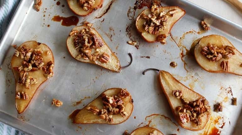 Roasted pear halves topped with honey pecans.