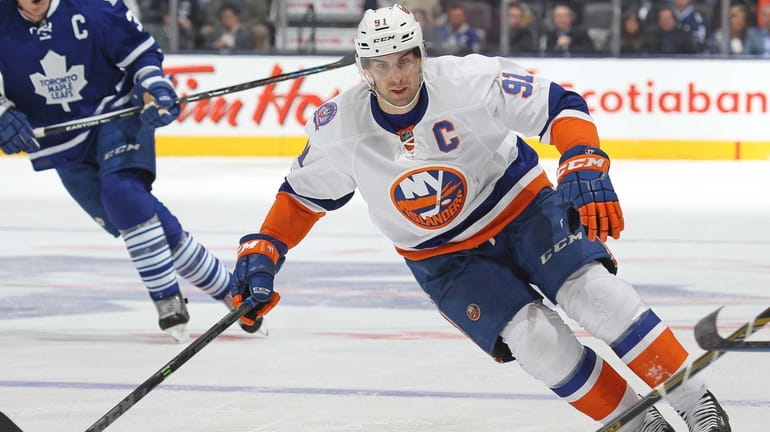 John Tavares of the New York Islanders skates after a...