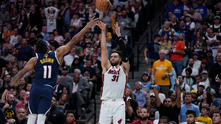 Miami Heat guard Max Strus (31) shoots over Denver Nuggets...