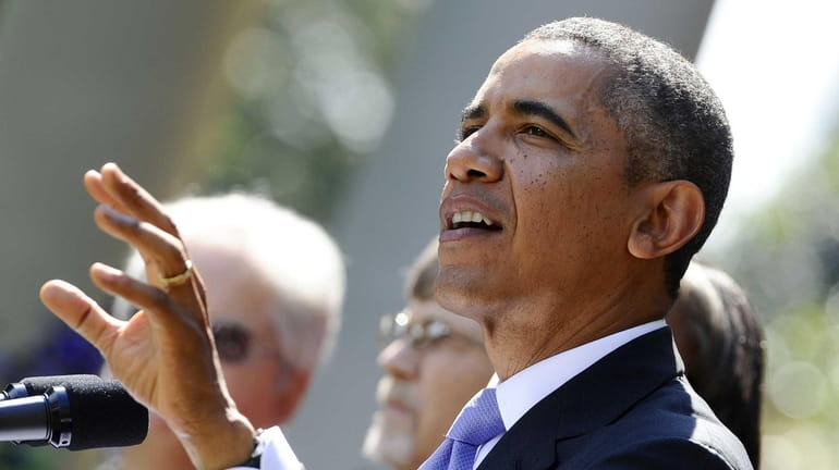 President Barack Obama speaks in the Rose Garden of the...