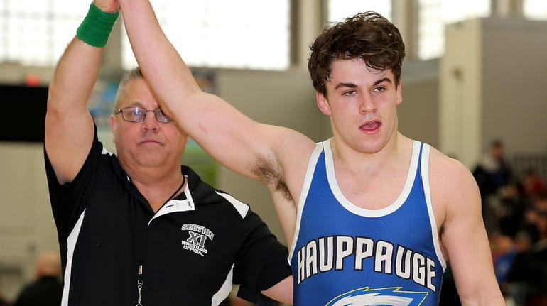 Hauppauge's Danny Mauriello wins the 170-pound weight class at the...