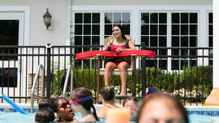 Isabella DeLeon, of Westbury, 16, works as a lifeguard at...