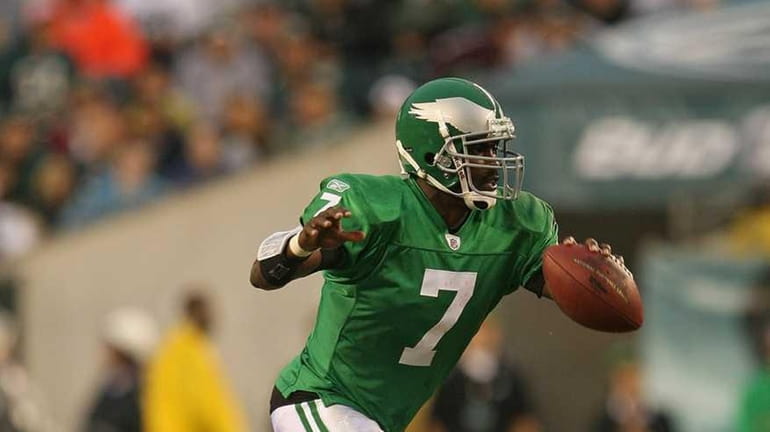 Michael Vick #7 of the Philadelphia Eagles rushes during a...