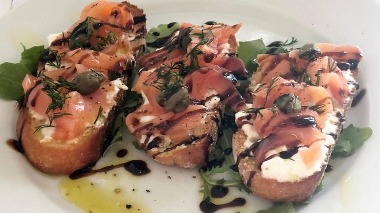 Smoked salmon crostini with burrata at Angelo's, which has replaced...