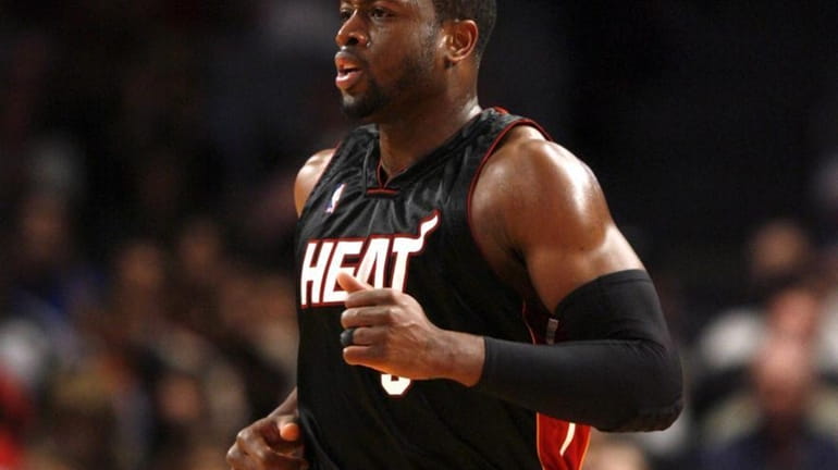 Miami Heat #3 Dwayne Wade runs down the court against...