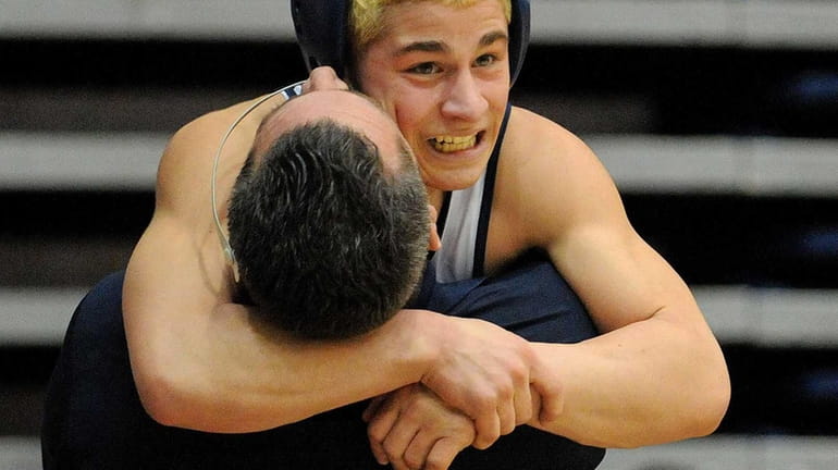 Jimmy Leach of Eastport-South Manor celebrates with head coach Nick...