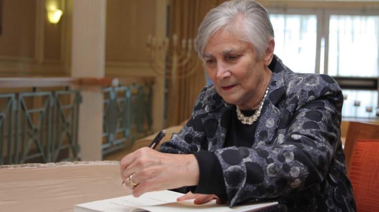 Diane Ravitch, an educational policy analyst and author, signs a...
