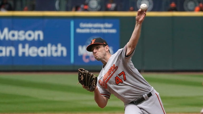 Baltimore Orioles starting pitcher John Means throws against the Seattle...