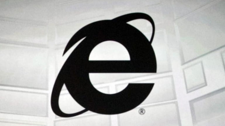 The Microsoft Internet Explorer logo projected on a screen during...