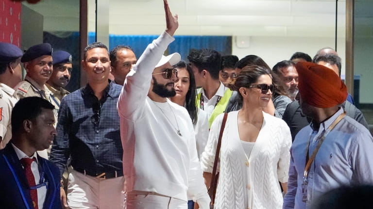 Bollywood actors Ranveer Singh, left and Deepika Padukone arrive at...