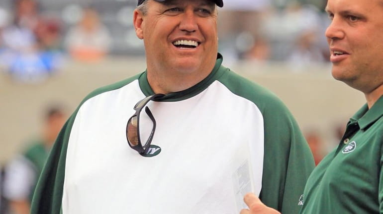 Jets head coach Rex Ryan smiles on the last day...