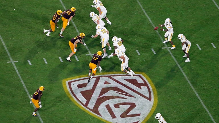 FILE - The Pac-12 logo is shown during the second...