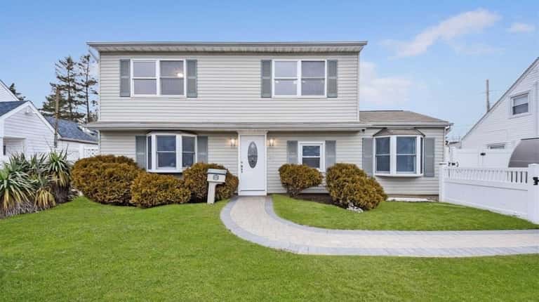 This Levittown Colonial, with five bedrooms and two bathrooms, is...