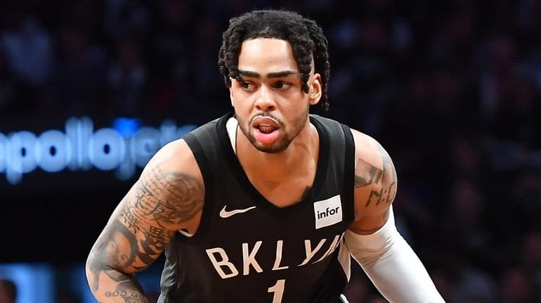 Nets guard D'Angelo Russell dribbles the ball in the second...