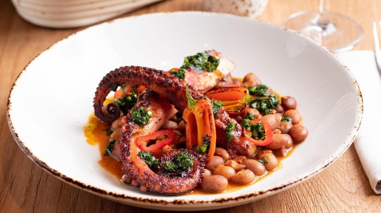 Grilled Spanish octopus with chorizo, fresno chilies and cranberry beans,...