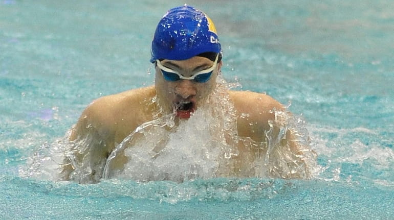 Jack Casey of Hauppauge competes in the 100 yard breaststroke...
