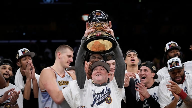 Denver Nuggets head coach Michael Malone holds the conference championship...