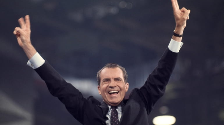 Richard Nixon waves to delegates and spectators after winning the Republican...