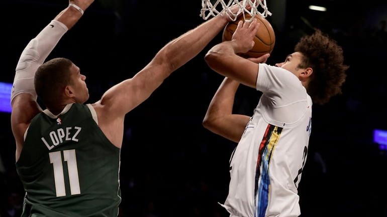 Brook Lopez of the Bucks blocks a shot in the...