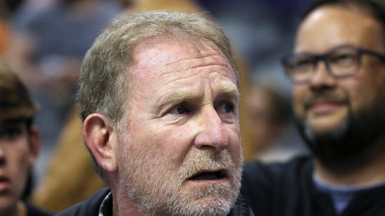 FILE- Phoenix Suns owner Robert Sarver watches his team play...