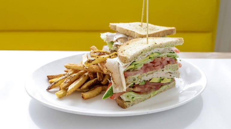 The triple decker turkey-avocado sandwich at the Silver Lining Diner,...