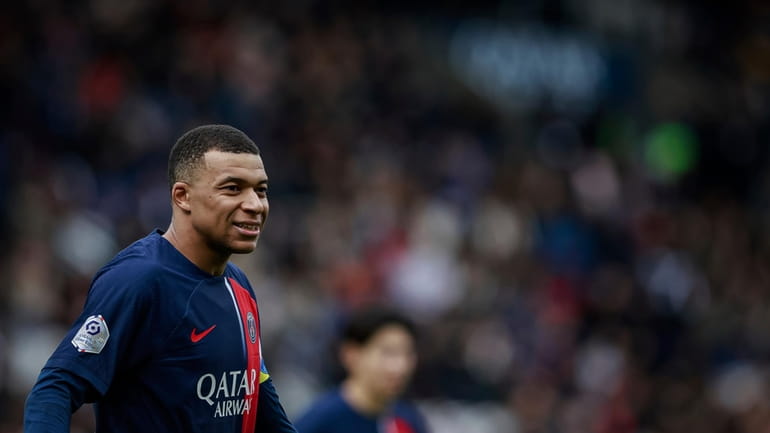 PSG's Kylian Mbappe looks on during the French League One...