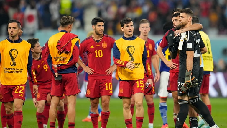 Spain players leave the pitch at the end of the...