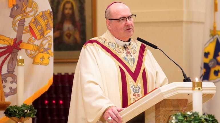 Auxiliary Bishop Richard G. Henning of Rockville Centre delivers the...