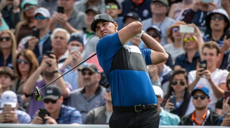 Brooks Koepka tees off at the first tee during the final...