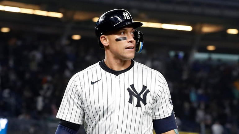 Aaron Judge #99 of the Yankees reacts after flying out...