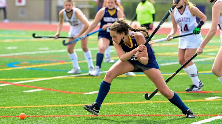 Sophia Bica #5 of Northport hits the ball against Garden...