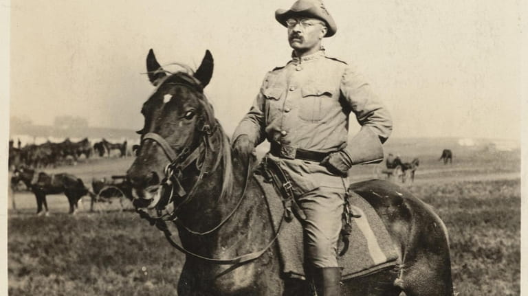 Theodore Roosevelt on horseback at Camp Wikoff in Montauk in...
