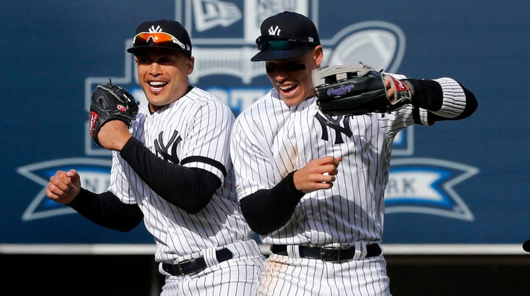 Giancarlo Stanton and Aaron Judge of the Yankees celebrate after...