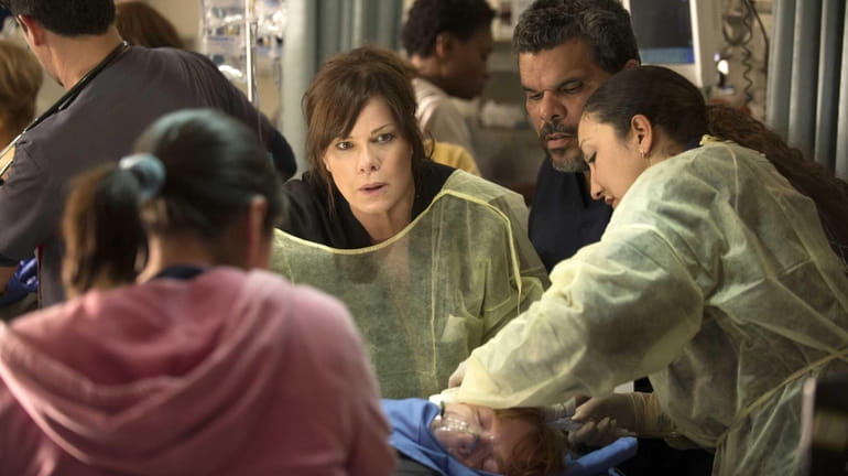Marcia Gay Harden, center, stars in CBS' new medical drama...