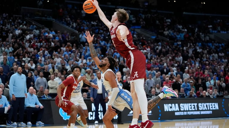 Alabama forward Grant Nelson, right, blocks a shot from North...