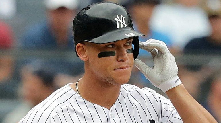 Yankees rightfielder Aaron Judge reacts after striking out inthe third...