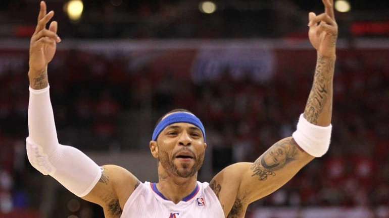 Kenyon Martin of the Los Angeles Clippers reacts after dunking...