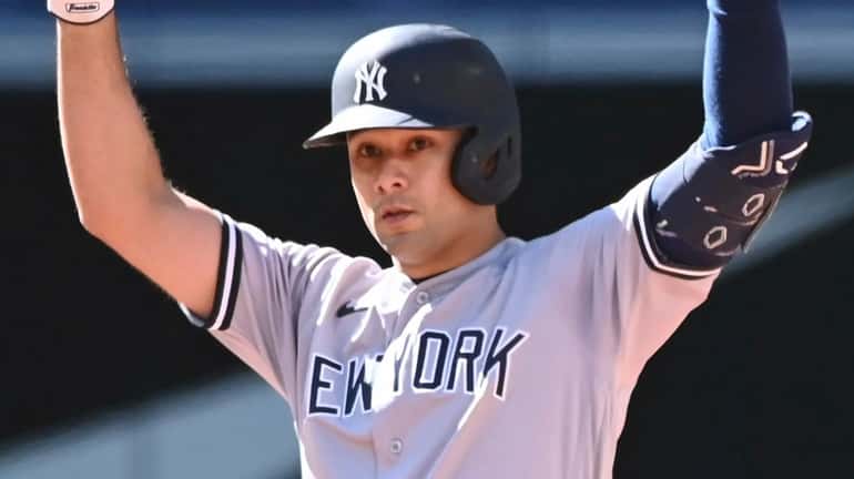 The Yankees' Isiah Kiner-Falefa gestures after hitting an RBI double...