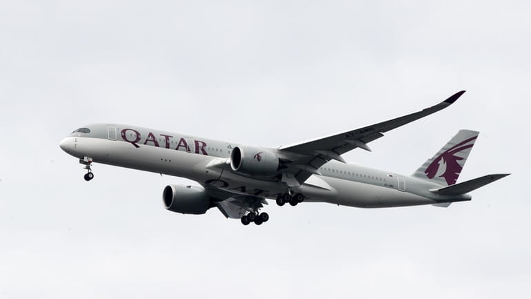 A Qatar Airways jet approaches Philadelphia International Airport in Philadelphia,...