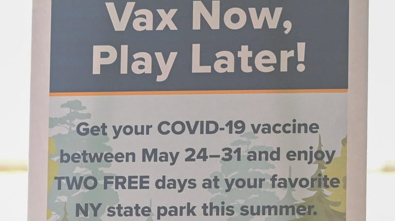 "Vax Now, Play Later!" said a sign promoting New York...