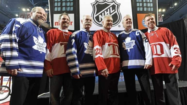 Retired Toronto Maple Leafs players, from left, Wendell Clark, Lanny...