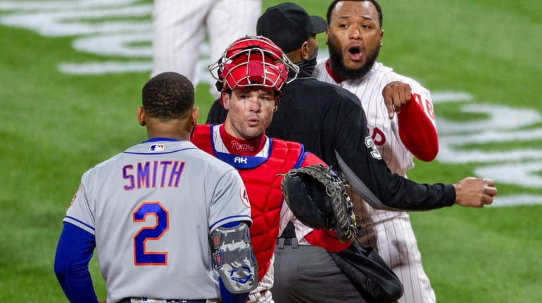 Philadelphia Phillies relief pitcher Jose Alvarado, right, has an altercation...