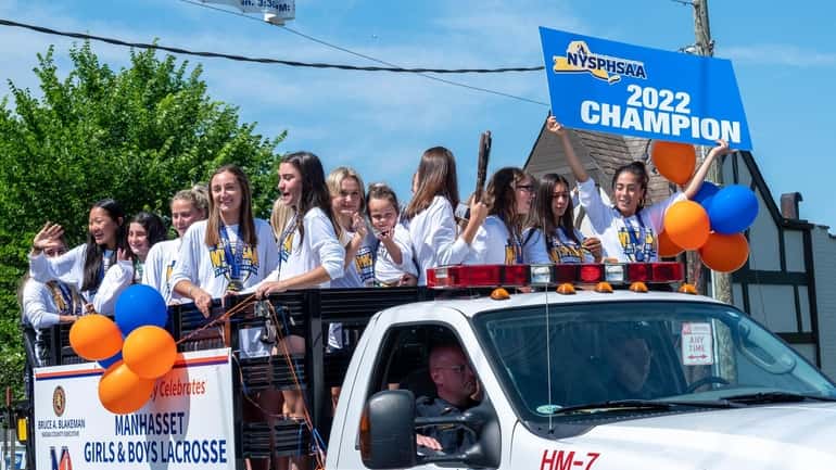 A float carrying the Manhasset girls lacrosse team is seen...