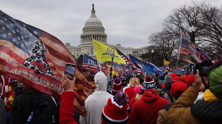 Trump supporters amass Jan. 6 at the U.S. Capitol before...