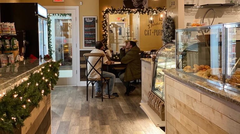 Catpurrccinos Cat Cafe combines fresh pastry and coffee with a...
